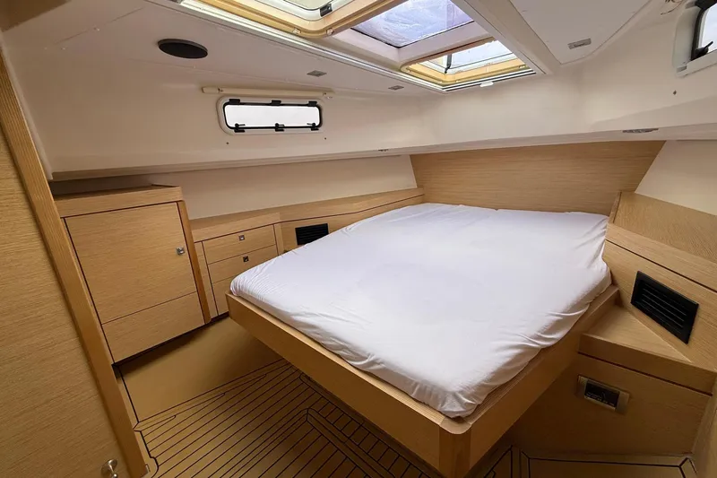  Yacht Photos Pics Luxurious cabin interior of 2013 Fjord 40' Open yacht with modern wood finish.