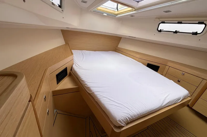  Yacht Photos Pics Luxurious cabin interior of 2013 Fjord 40' Open yacht with modern wood finish.