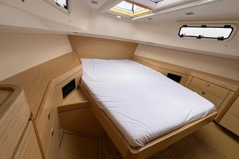  Yacht Photos Pics Luxurious cabin interior of 2013 Fjord 40' Open yacht with modern wood finish.