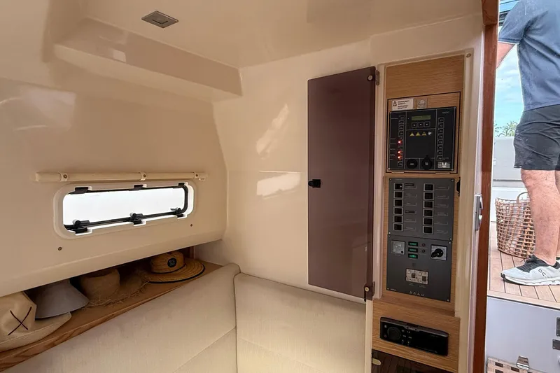  Yacht Photos Pics Interior of 2013 Fjord 40' Open yacht with control panel and seating area.