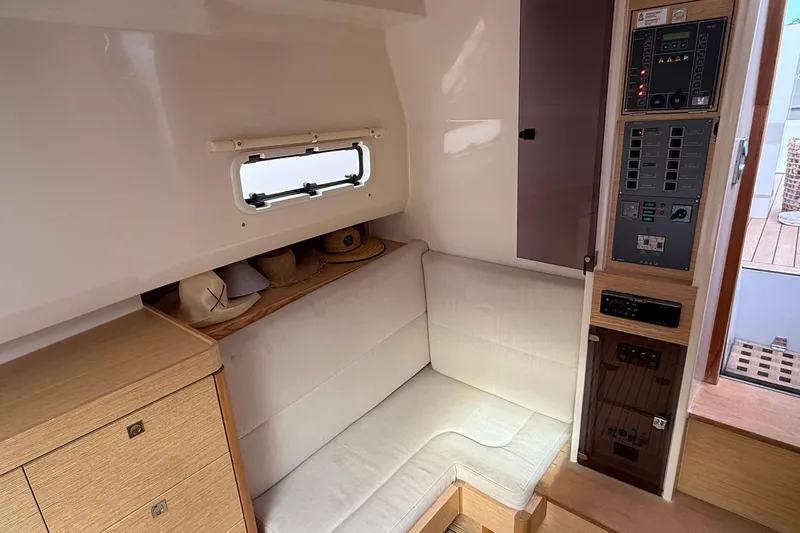  Yacht Photos Pics Interior of 2013 Fjord 40' Open yacht with seating and control panel.