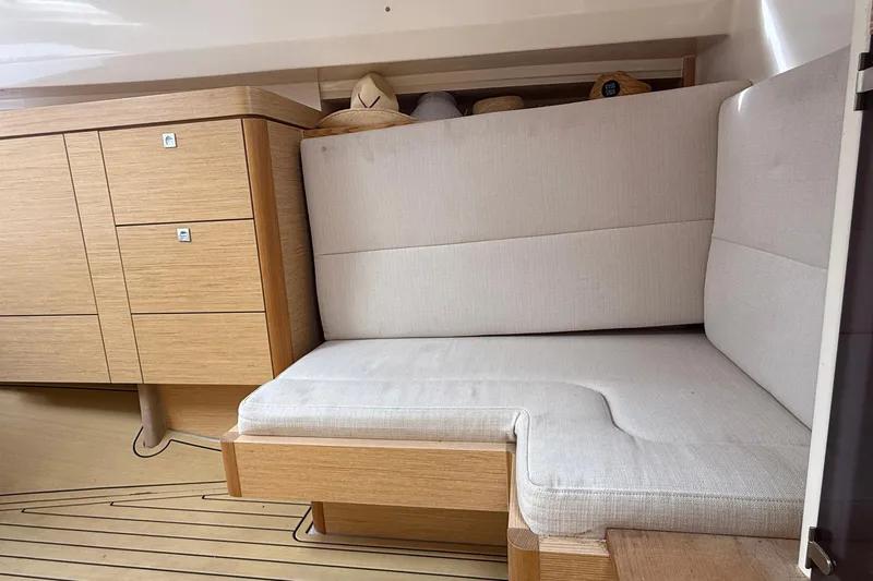  Yacht Photos Pics Interior of 2013 Fjord 40' Open yacht with beige seating and wooden cabinetry.