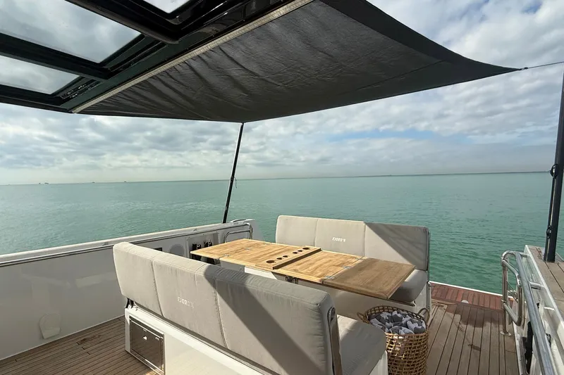  Yacht Photos Pics Luxurious 2013 Fjord 40' Open yacht with shaded deck and ocean view.