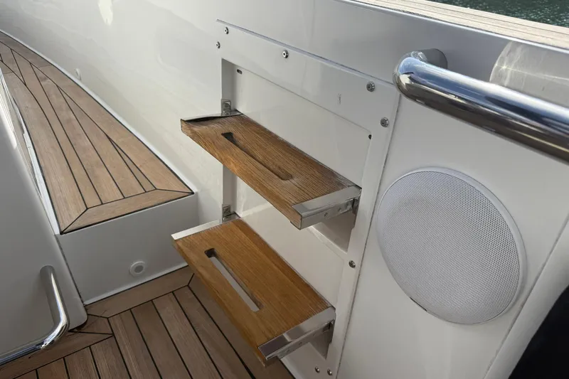  Yacht Photos Pics Teak steps and speaker on 2013 Fjord 40' Open yacht deck.