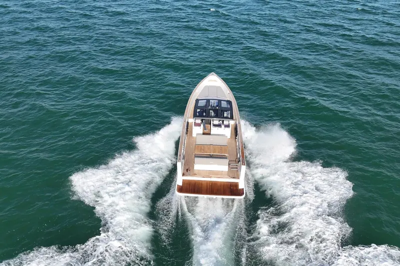  Yacht Photos Pics 2013 Fjord 40' Open yacht cruising on open water, aerial view.