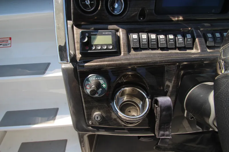  Yacht Photos Pics Control panel of 2018 Monterey 295 Sport Yacht with switches and cup holder.