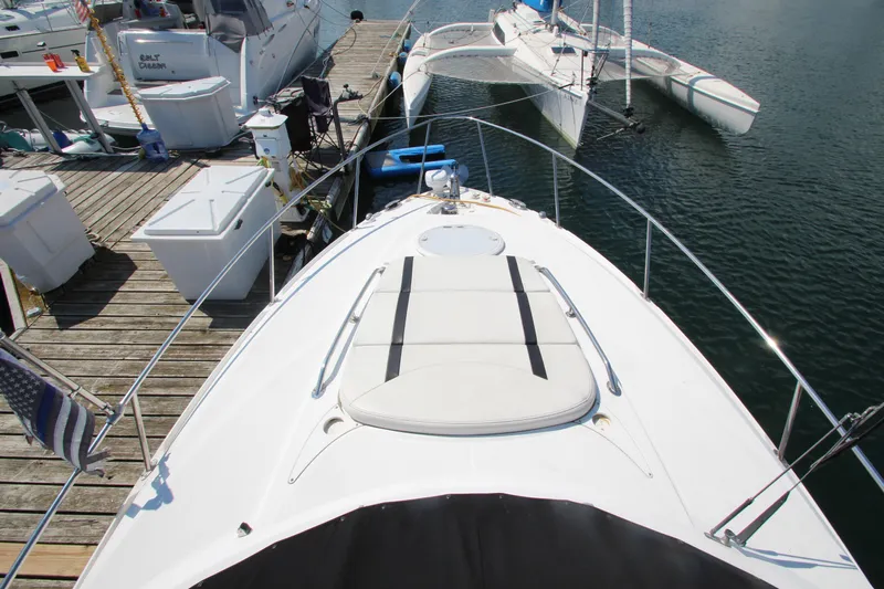 Yacht Photos Pics 2018 Monterey 295 Sport Yacht docked, showcasing sleek design and spacious deck.