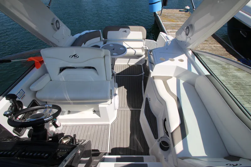  Yacht Photos Pics 2018 Monterey 295 Sport Yacht interior with white seating and sleek design.