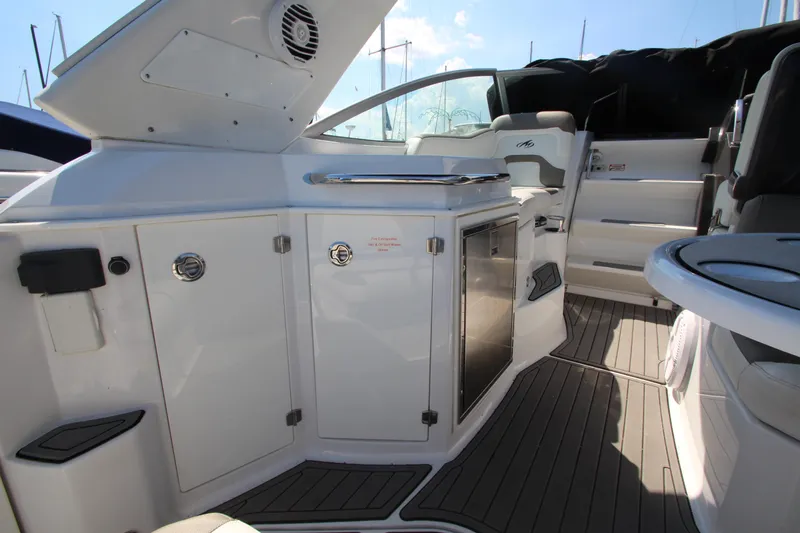  Yacht Photos Pics 2018 Monterey 295 Sport Yacht interior with sleek cabinetry and modern seating.