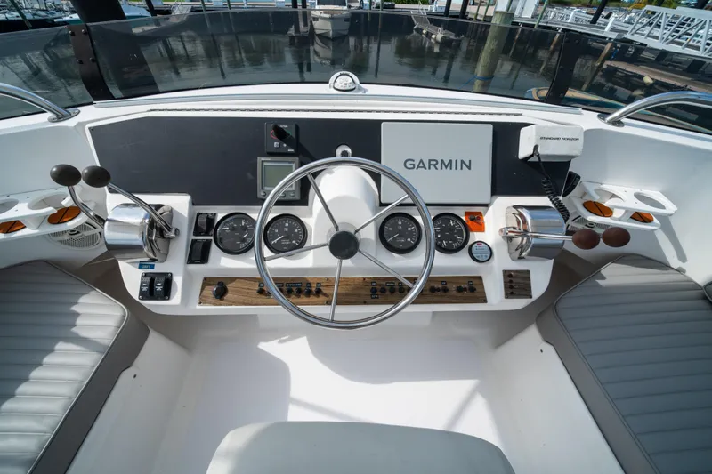 Sea Bandit Yacht Photos Pics 2003 Mainship 390 Trawler helm with Garmin navigation and control instruments.