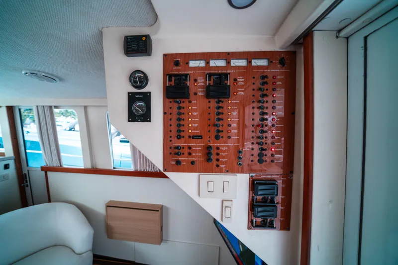 Sea Bandit Yacht Photos Pics Control panel inside 2003 Mainship 390 Trawler, featuring gauges and switches.