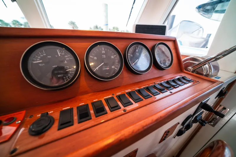 Sea Bandit Yacht Photos Pics 2003 Mainship 390 Trawler dashboard with gauges and control switches.