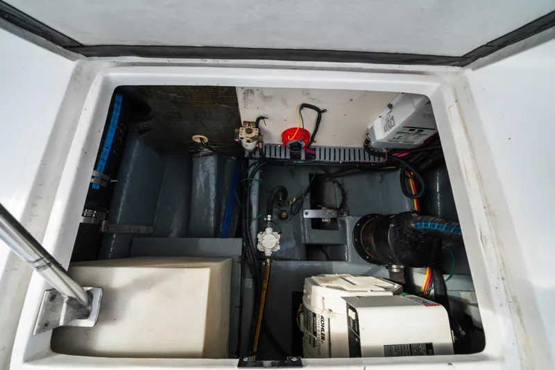 Sea Bandit Yacht Photos Pics Engine compartment of 2003 Mainship 390 Trawler, showcasing mechanical components and wiring.