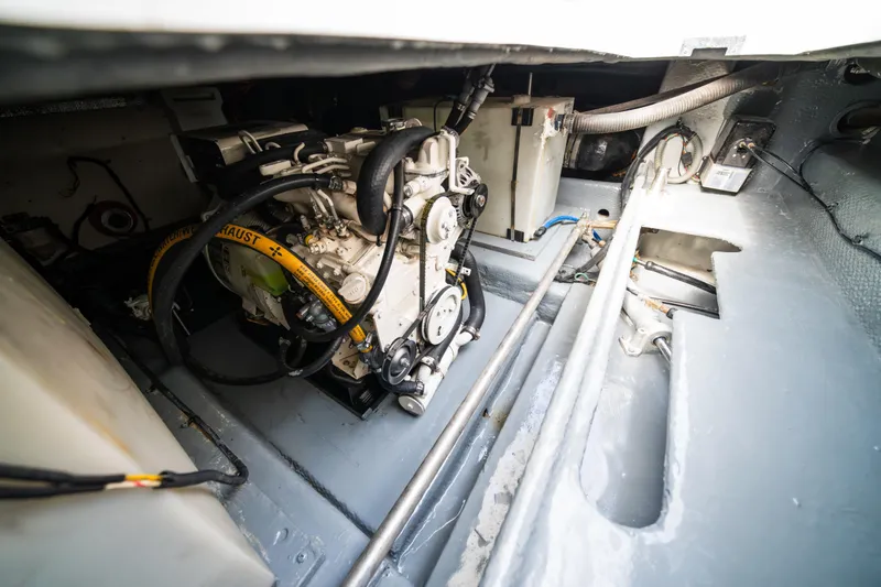 Sea Bandit Yacht Photos Pics Engine room of 2003 Mainship 390 Trawler, showcasing mechanical components and wiring.