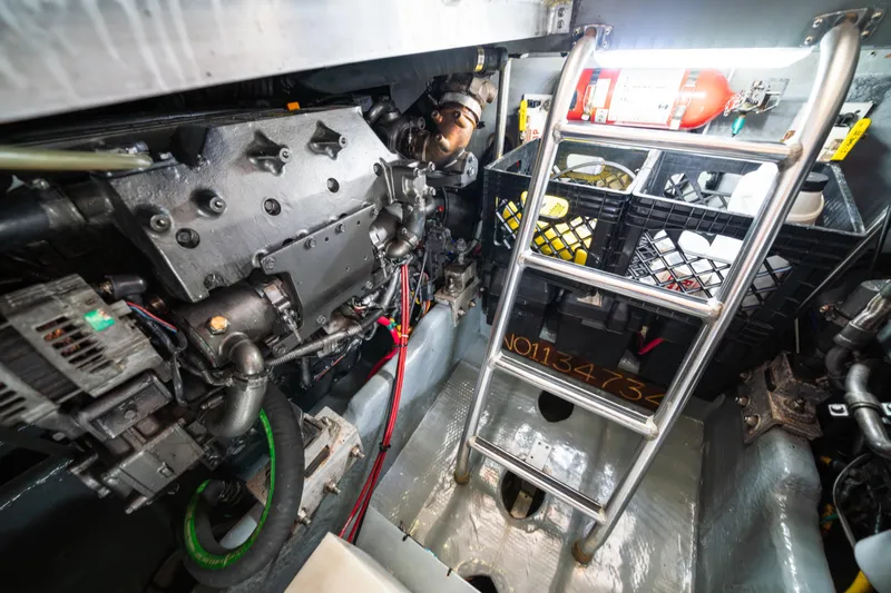 Sea Bandit Yacht Photos Pics Engine room of 2003 Mainship 390 Trawler with ladder and equipment.