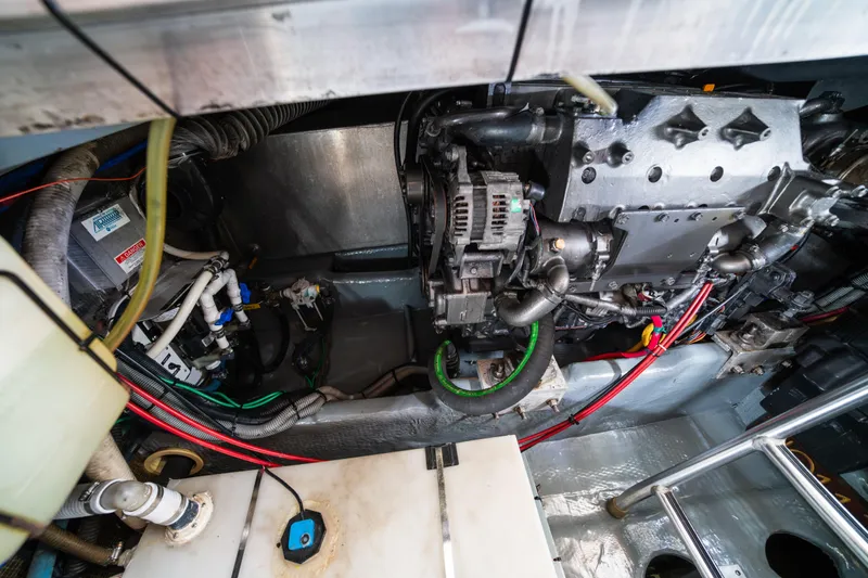 Sea Bandit Yacht Photos Pics Engine room of a 2003 Mainship 390 Trawler, showcasing mechanical components and wiring.
