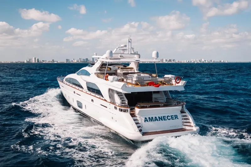 Amanecer Yacht Photos Pics Luxurious 2009 Azimut 105 yacht cruising on open sea under clear skies.