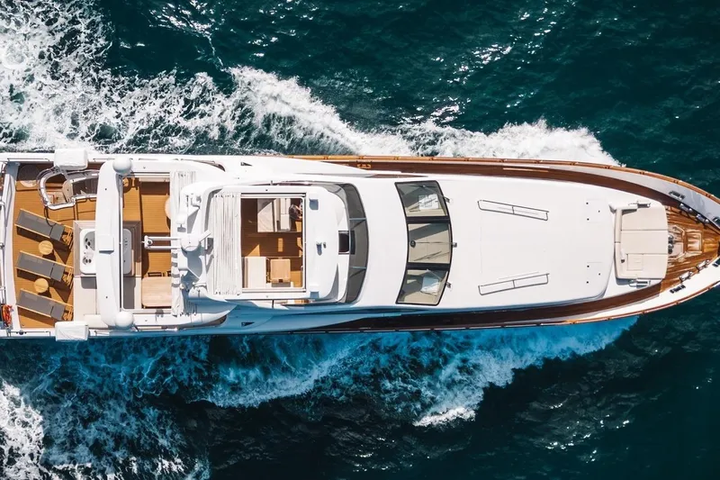 Amanecer Yacht Photos Pics Aerial view of 2009 Azimut 105 yacht cruising on the ocean.