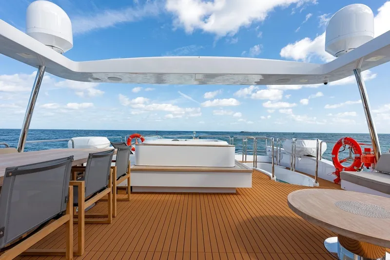 Amanecer Yacht Photos Pics Luxurious 2009 Azimut 105 yacht deck with ocean view and modern seating.