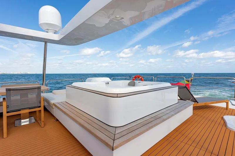 Amanecer Yacht Photos Pics Luxurious 2009 Azimut 105 yacht deck with jacuzzi and ocean view.