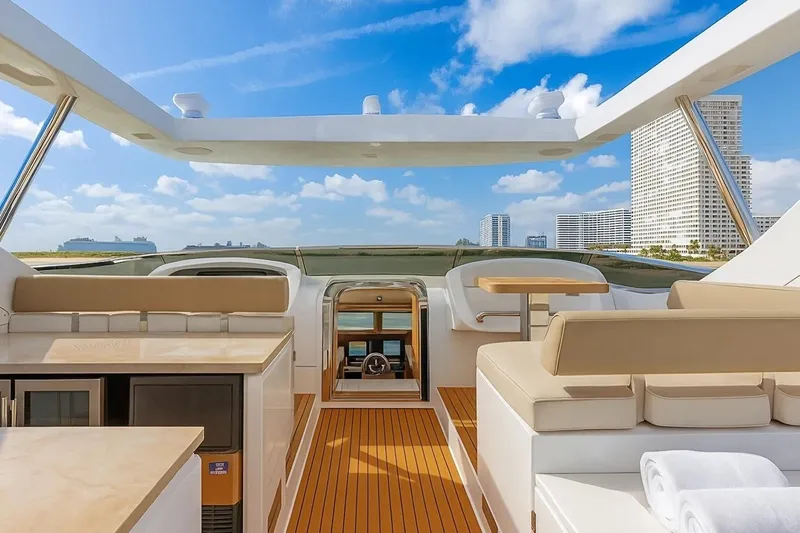 Amanecer Yacht Photos Pics Luxurious 2009 Azimut 105 yacht deck with modern seating and ocean view.
