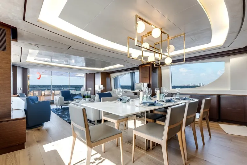 Amanecer Yacht Photos Pics Luxurious interior of 2009 Azimut 105 yacht with elegant dining area and ocean view.