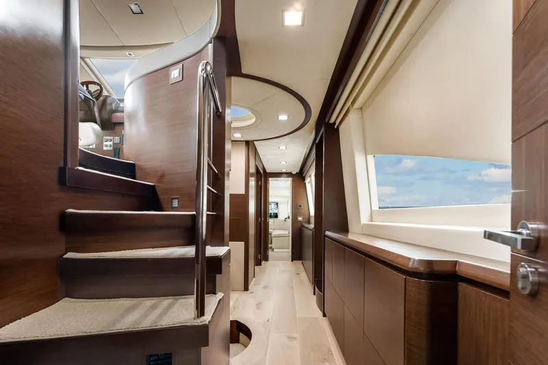 Amanecer Yacht Photos Pics Luxurious interior of 2009 Azimut 105 yacht with elegant wood finishes and modern design.