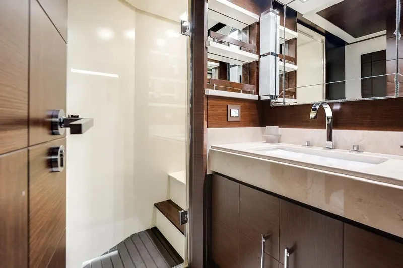 Amanecer Yacht Photos Pics Luxurious bathroom interior on 2009 Azimut 105 yacht, featuring modern fixtures and elegant design.