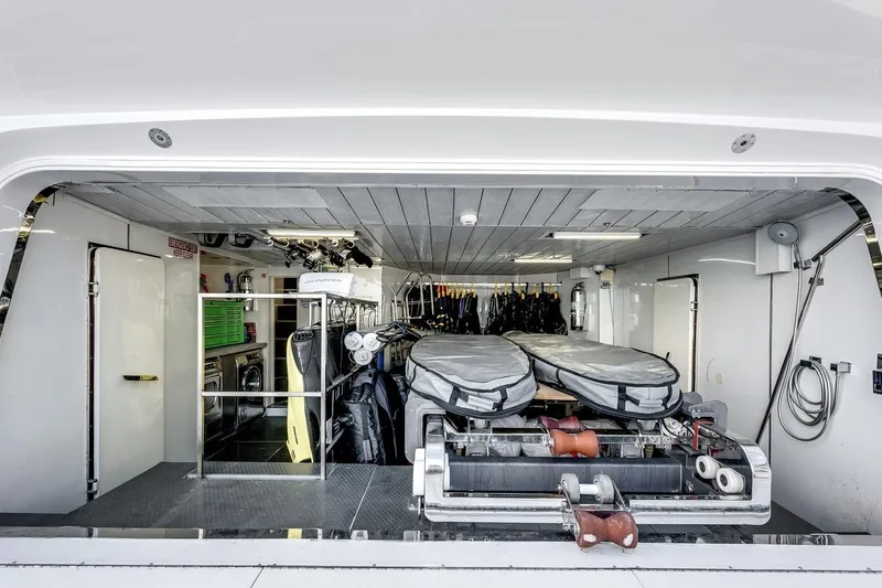 Amanecer Yacht Photos Pics Interior of 2009 Azimut 105 yacht showing storage area with equipment and gear.