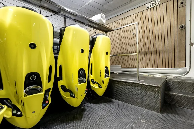 Amanecer Yacht Photos Pics Yellow underwater scooters in the storage area of a 2009 Azimut 105 yacht.