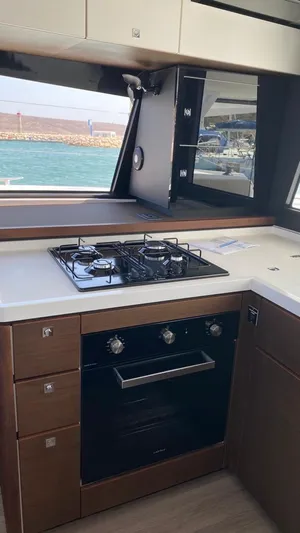 Hayat Yacht Photos Pics Modern kitchen in a 2021 Nautitech 46 Fly catamaran with stove and oven.