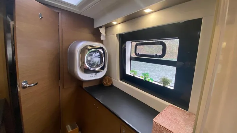 Hayat Yacht Photos Pics Interior of 2021 Nautitech 46 Fly yacht with modern amenities and scenic window view.