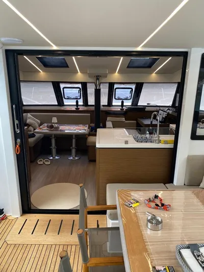 Hayat Yacht Photos Pics Interior of 2021 Nautitech 46 Fly catamaran, featuring modern kitchen and dining area.