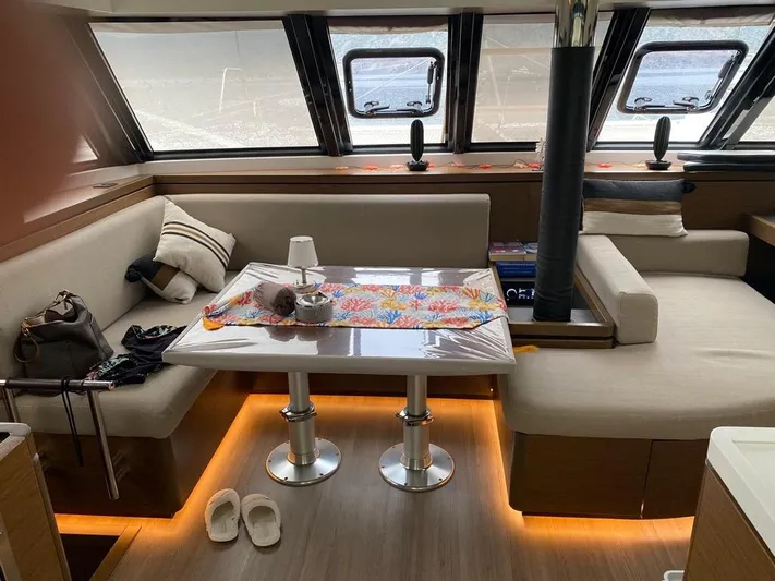 Hayat Yacht Photos Pics Interior of 2021 Nautitech 46 Fly catamaran with cozy seating and table.