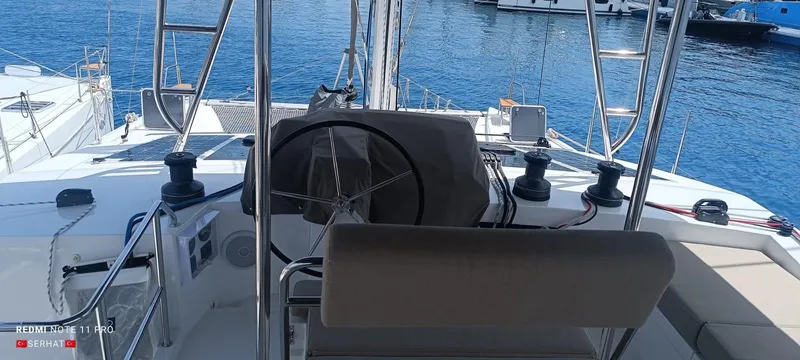 Hayat Yacht Photos Pics Nautitech 46 Fly 2021 yacht helm with ocean view and marina background.