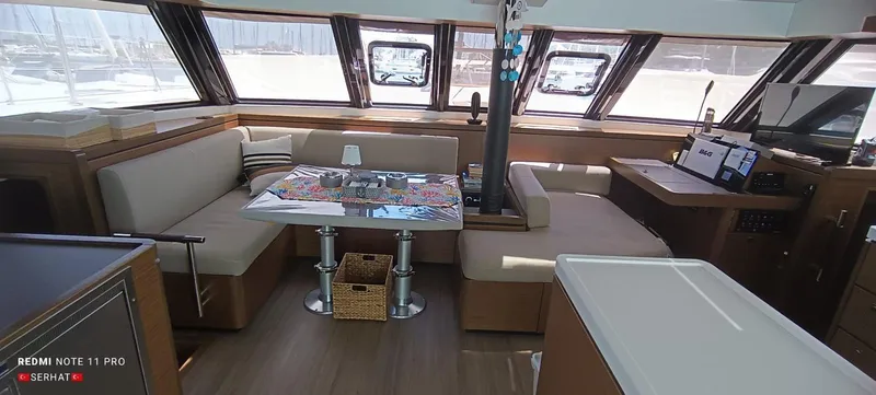Hayat Yacht Photos Pics Interior of 2021 Nautitech 46 Fly catamaran with spacious seating and modern navigation equipment.