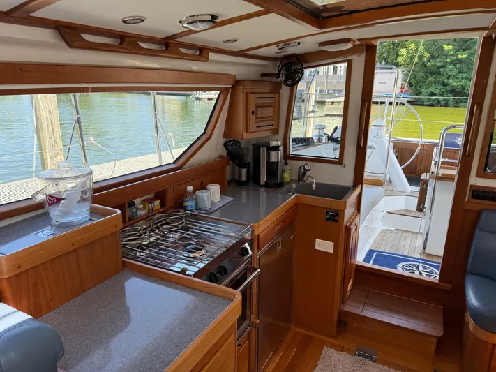 North Sound Yacht Photos Pics 2024 Tartan 455 yacht interior with modern kitchen and outdoor deck view.