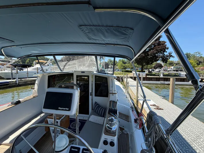 North Sound Yacht Photos Pics 2024 Tartan 455 yacht docked, featuring a spacious cockpit and modern navigation equipment.