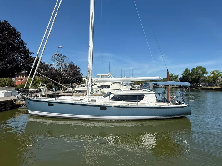 North Sound Yacht Photos Pics 2024 Tartan 455 sailboat docked in a marina under clear blue skies.
