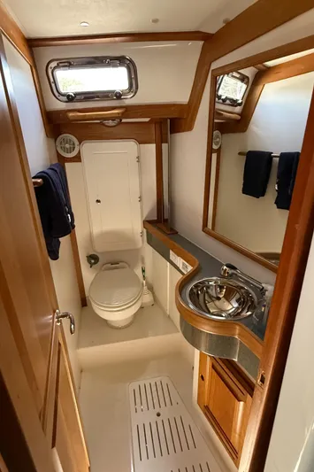 North Sound Yacht Photos Pics 2024 Tartan 455 yacht bathroom with modern fixtures and wooden accents.