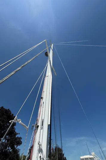 North Sound Yacht Photos Pics Sailboat mast of 2024 Tartan 455 against clear blue sky.