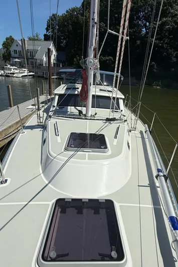 North Sound Yacht Photos Pics 2024 Tartan 455 sailboat docked, showcasing deck and cabin features.