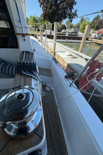 North Sound Yacht Photos Pics 2024 Tartan 455 sailboat deck with winch, ropes, and marina view.