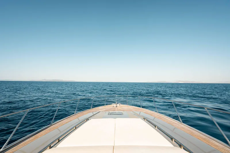  Yacht Photos Pics Bow view of 2009 Riva 63 Vertigo yacht cruising on open sea.