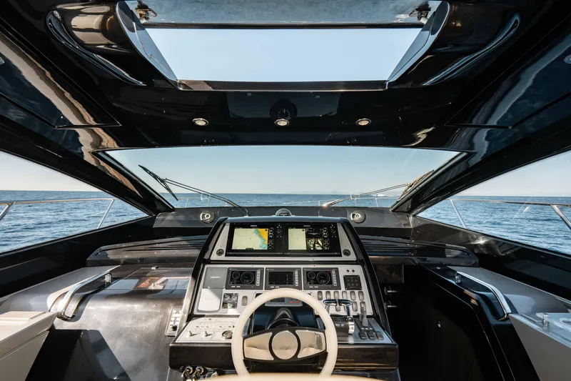  Yacht Photos Pics Cockpit view of 2009 Riva 63 Vertigo yacht with modern navigation controls.