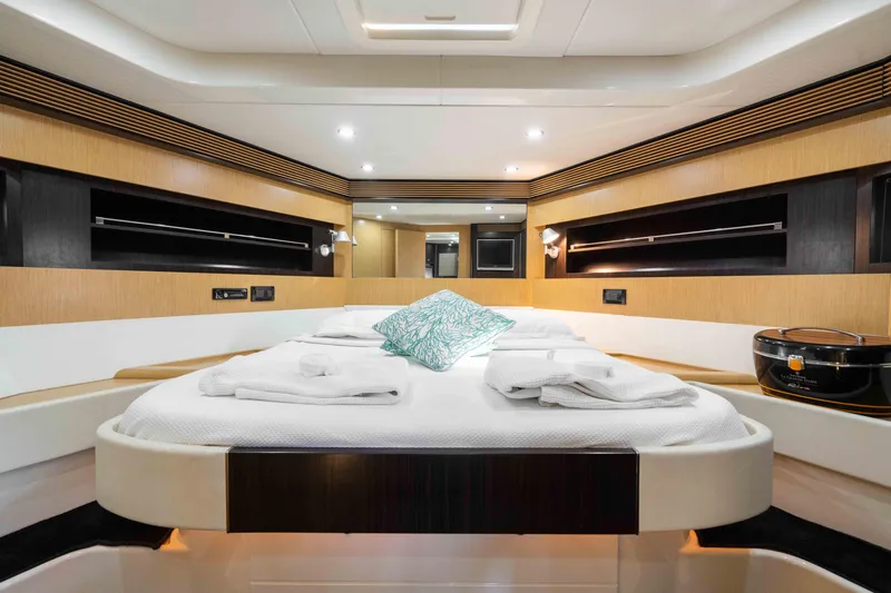  Yacht Photos Pics Luxurious interior of 2009 Riva 63 Vertigo yacht with modern design and cozy bedding.