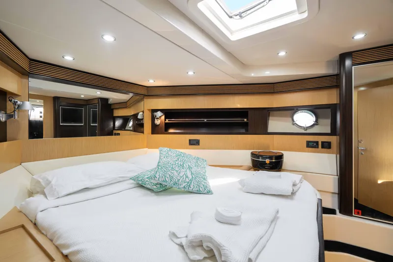  Yacht Photos Pics Luxurious cabin interior of 2009 Riva 63 Vertigo yacht with modern design and skylight.
