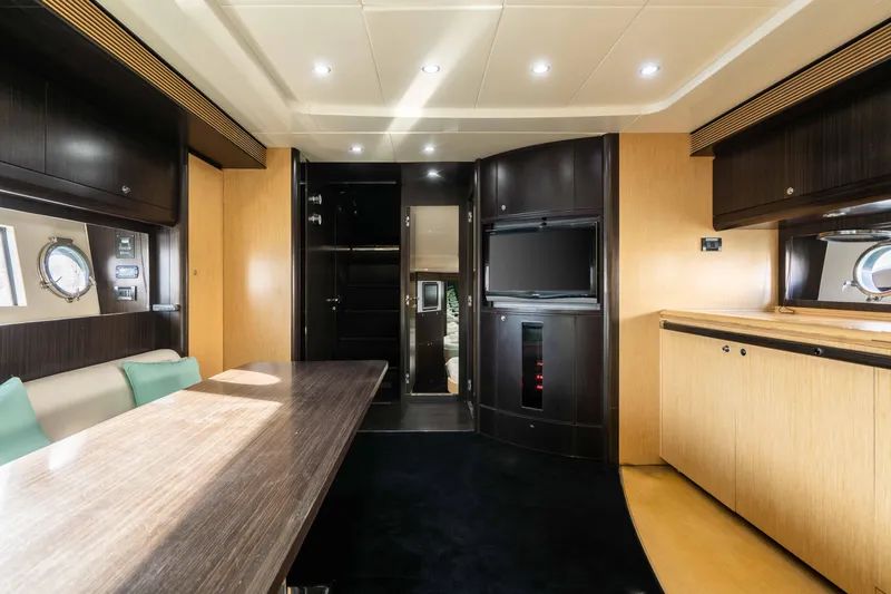  Yacht Photos Pics Luxurious interior of a 2009 Riva 63 Vertigo yacht with modern furnishings and elegant design.