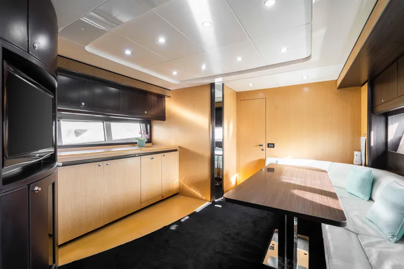  Yacht Photos Pics Luxurious interior of 2009 Riva 63 Vertigo yacht with modern furnishings and sleek design.