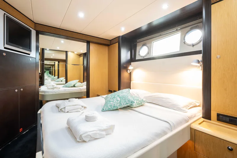  Yacht Photos Pics Luxurious cabin interior of 2009 Riva 63 Vertigo yacht with modern amenities.